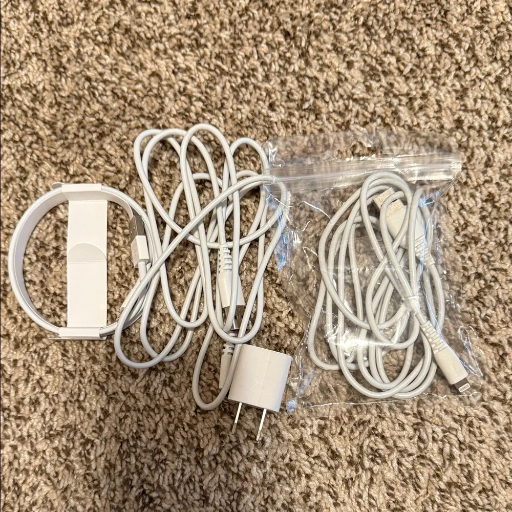 3 USB-A to Lightening Charging cables and one Apple charger block